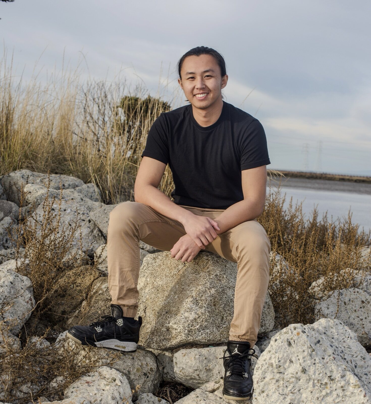 James Chen seated outdoors